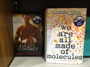 My book as staff pick beside some serious abs